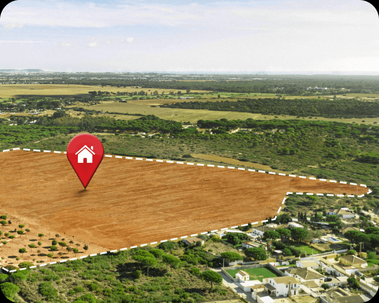 Aerial view of a marked land parcel with a location pin