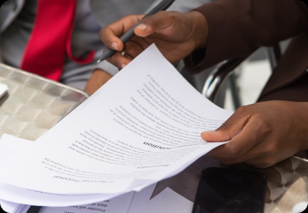 Professionals reviewing and signing property documents
